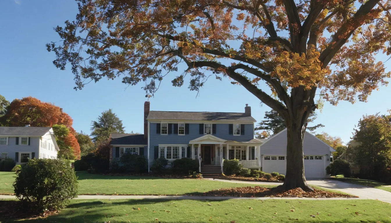 A tree removal provider working safely beside a house in Poolesville